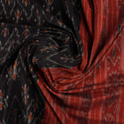 Elegant model styling of a black and orange Sambalpuri cotton saree showcasing the complete handloom look.