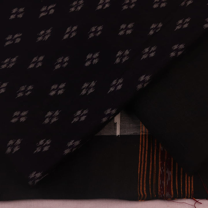 Detail of the black Sambalpuri cotton dress material's matching blouse piece with motifs.