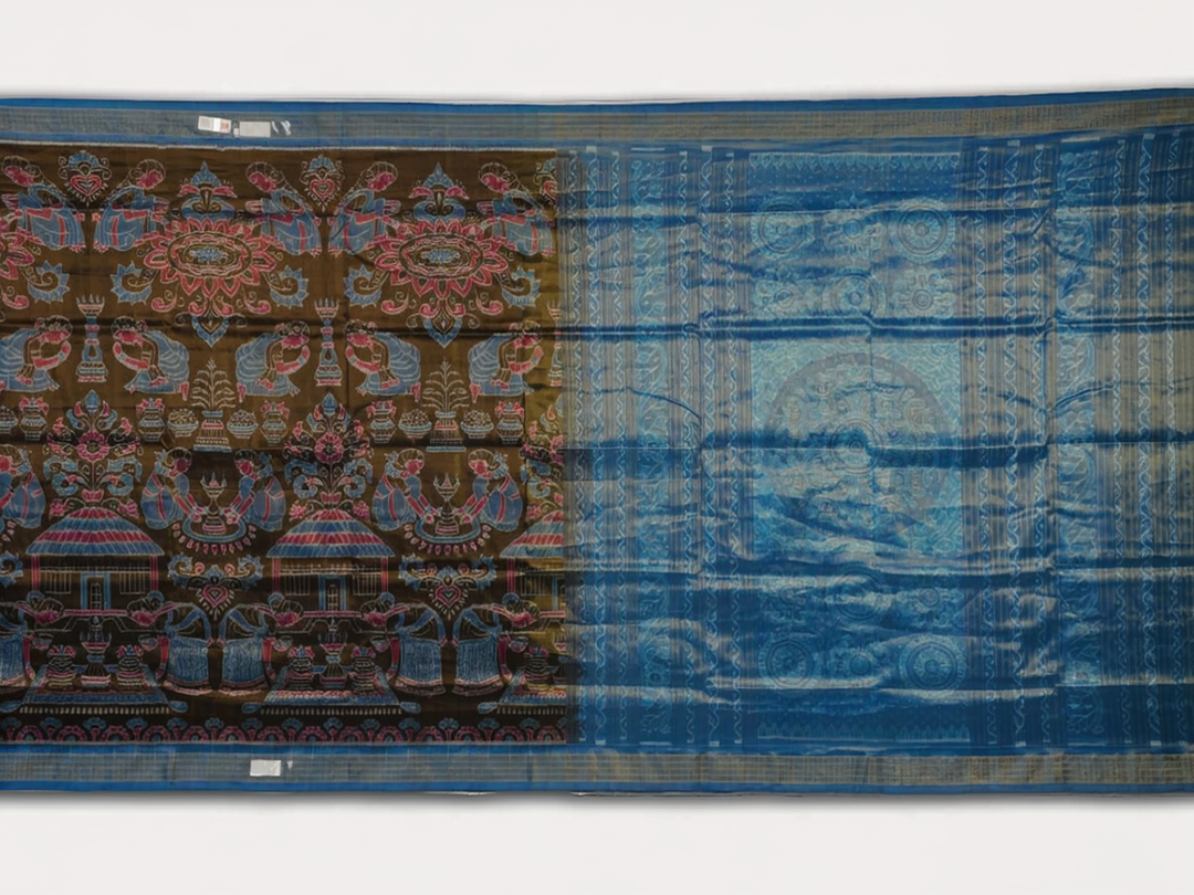 Close-up of Sambalpuri silk saree fabric, revealing rich blue multi-color weave texture and tissue motifs.