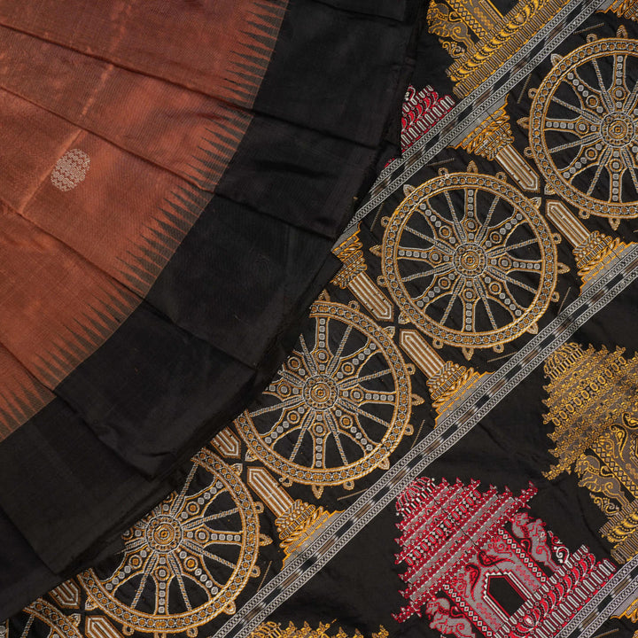 Extreme close-up of brown Bomkai silk saree fabric, revealing rich weave texture and luxurious feel.