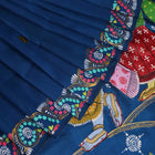 Close-up of handloom blue silk Patachitra saree fabric, showcasing the fine texture and hand-painted details.