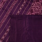 Close-up of cream tussar silk saree fabric with plain weave texture