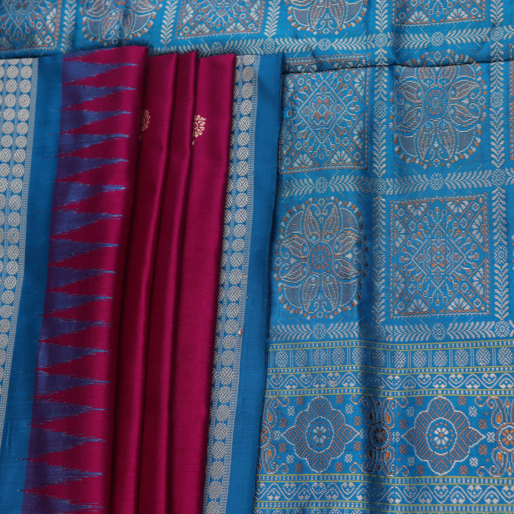 Close-up of Bomkai silk saree's textured weave, featuring magenta, blue, and butta pattern.