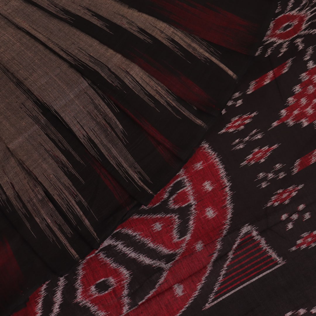 Styled view of a plain grey and black Sambalpuri cotton handloom saree.