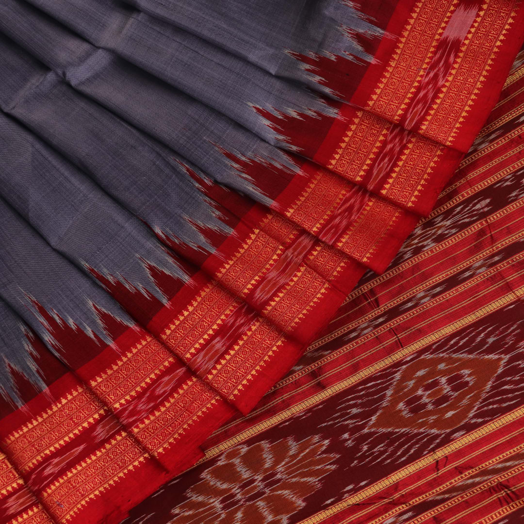 Grey Khandua silk saree styled and draped, showcasing the plain body and red border.