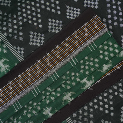 Elegant model draping a green and black Sambalpuri cotton saree with traditional Odisha handloom motifs.