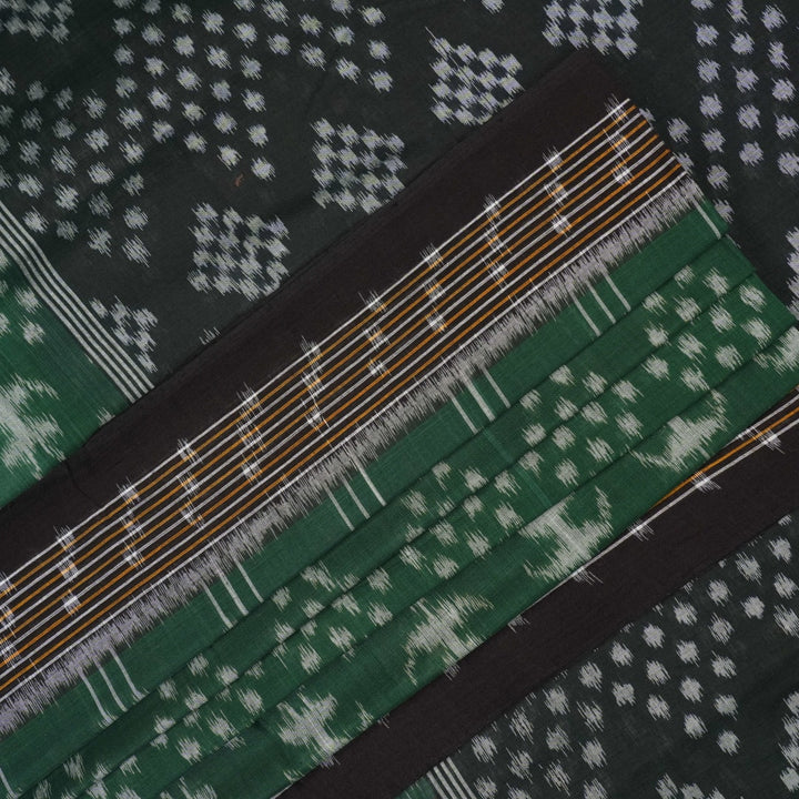 Elegant model draping a green and black Sambalpuri cotton saree with traditional Odisha handloom motifs.