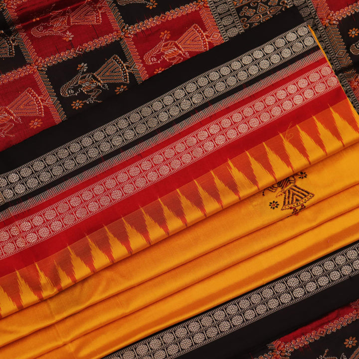 Close-up showcasing the smooth, golden-yellow silk texture of the Bomkai saree, adorned with intricate black butta patterns.