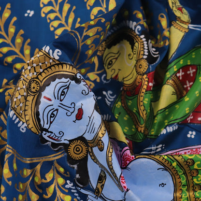 Close-up of the handwoven blue Patachitra silk saree, showcasing the detailed texture of the fabric.