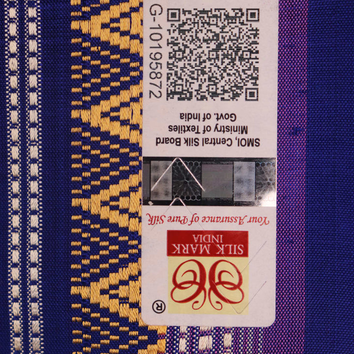 Close-up of pink and blue Dongria Silk Saree fabric texture with butta pattern.