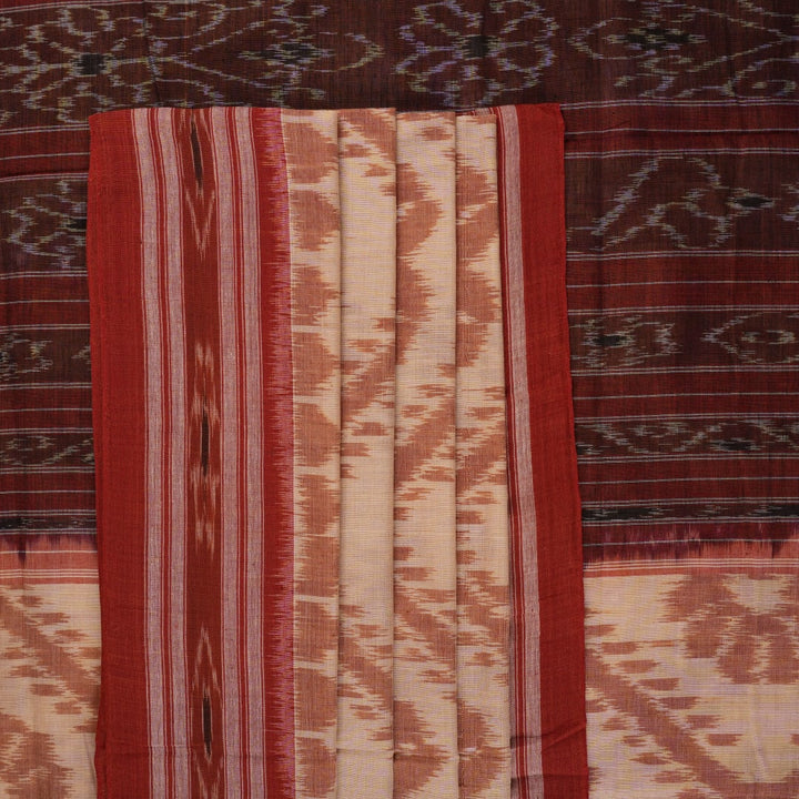 Traditional styling of a cream and rust Sambalpuri cotton saree draped on a model for a classic look.