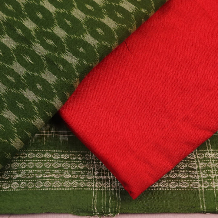 Close-up of the green Sambalpuri cotton dress material's blouse piece with red motifs.