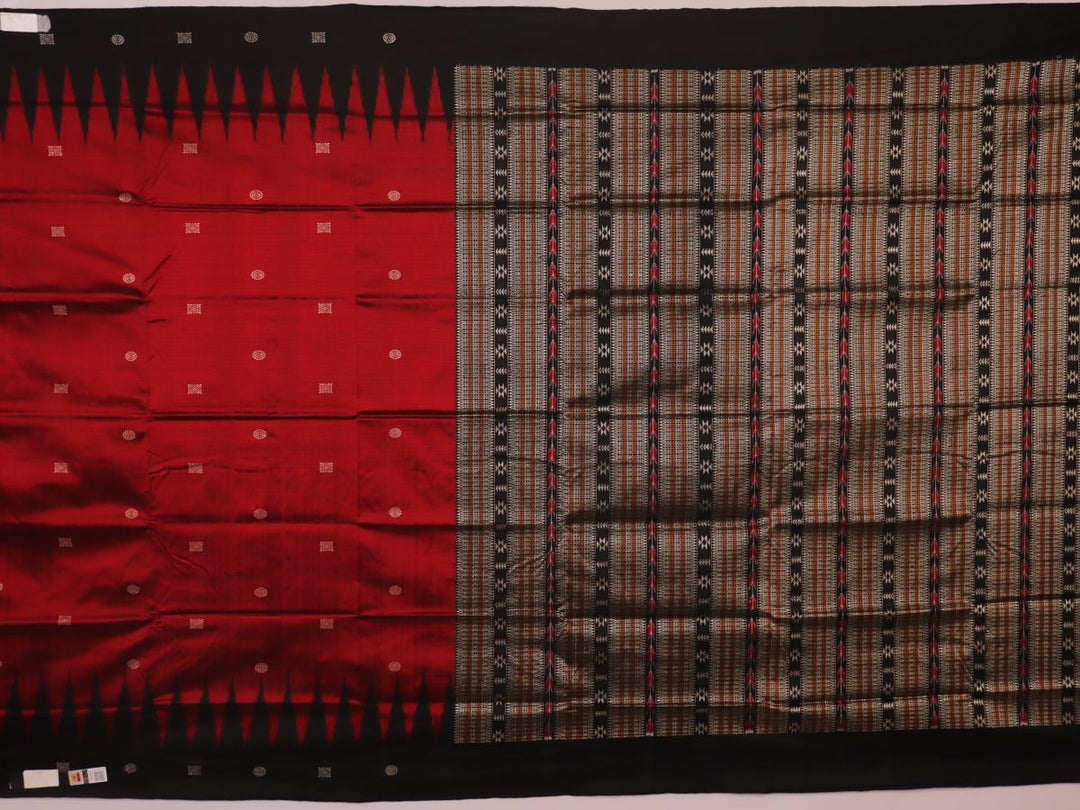 Close-up texture of handwoven Bomkai silk saree fabric: maroon and black threads forming butta pattern.