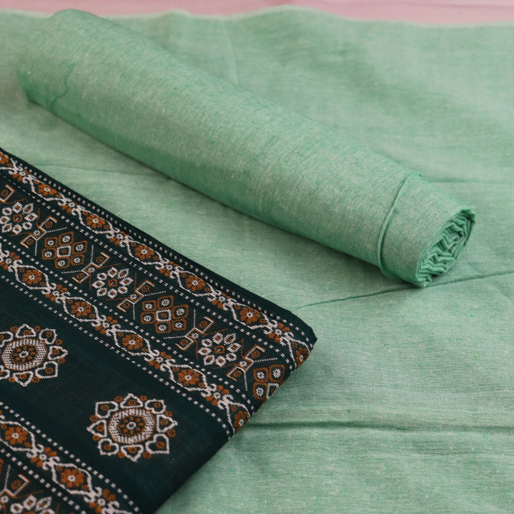 Coordinating green Bomkai cotton blouse piece with subtle weave details.