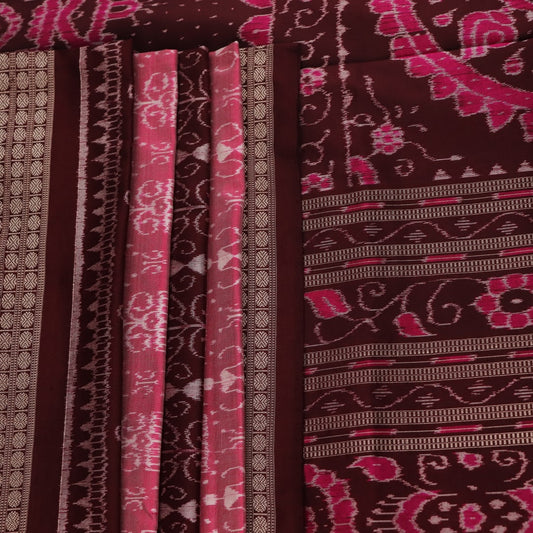 Close-up of peach and maroon Sambalpuri silk saree fabric showing intricate handloom texture and motifs.