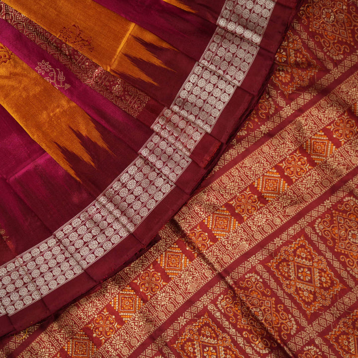 Ultra close-up of Bomkai silk saree fabric, revealing its luxurious texture and fine handloom weave.