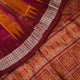 Ultra close-up of Bomkai silk saree fabric, revealing its luxurious texture and fine handloom weave.
