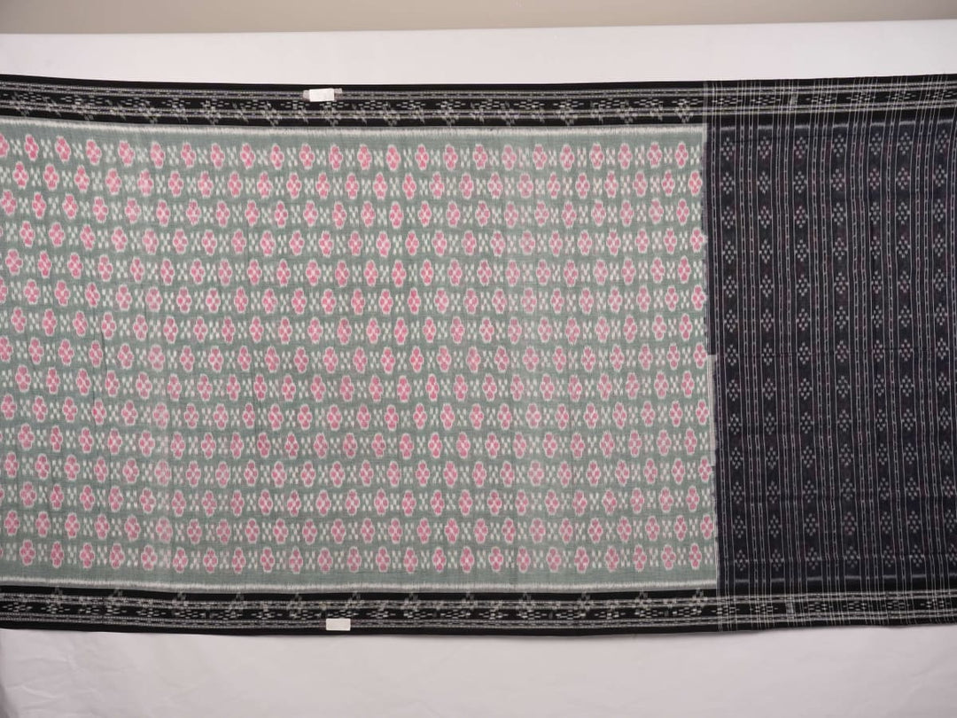 Model wearing a green and black Sambalpuri cotton saree showcasing traditional handloom drape and motifs.