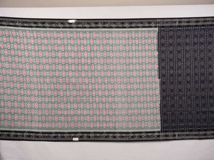 Model wearing a green and black Sambalpuri cotton saree showcasing traditional handloom drape and motifs.