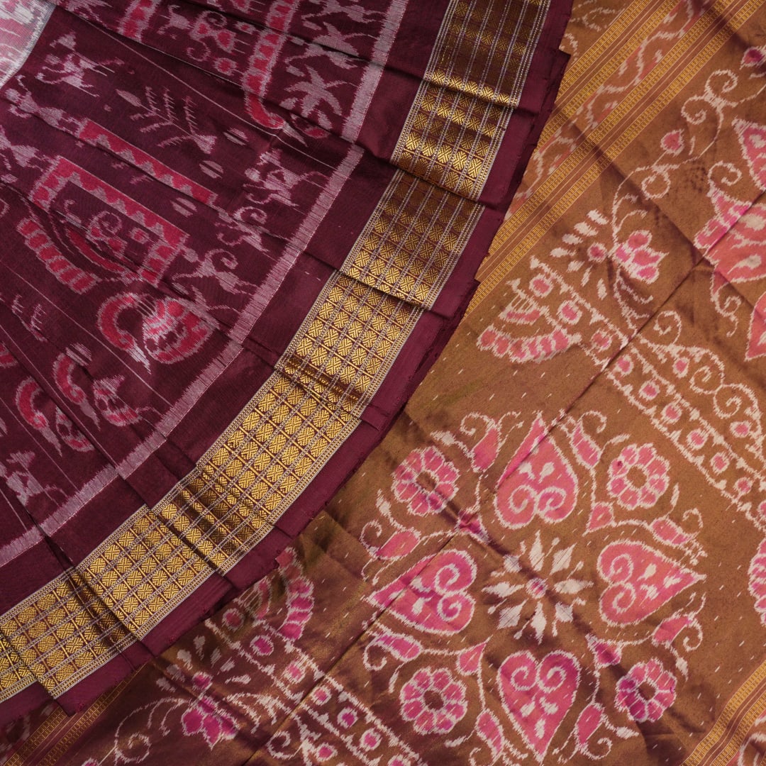 Close-up of luxurious silk fabric texture and intricate weave details of the multi-color Sambalpuri saree.