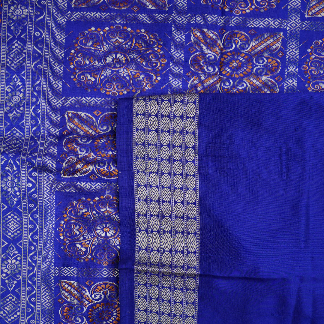 Ultra close-up of Bomkai Silk Saree fabric, highlighting the exquisite grey and blue weave texture.