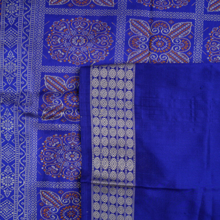 Ultra close-up of Bomkai Silk Saree fabric, highlighting the exquisite grey and blue weave texture.
