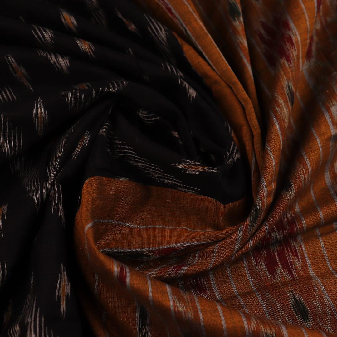 Black and yellow cotton Sambalpuri saree with motifs, styled and draped elegantly