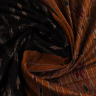 Black and yellow cotton Sambalpuri saree with motifs, styled and draped elegantly