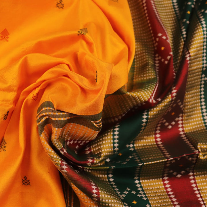 Close-up of yellow & green Sambalpuri Silk Saree fabric texture, showing Butta pattern.