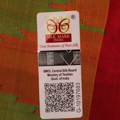 Close-up of plain green Sambalpuri silk saree fabric texture.