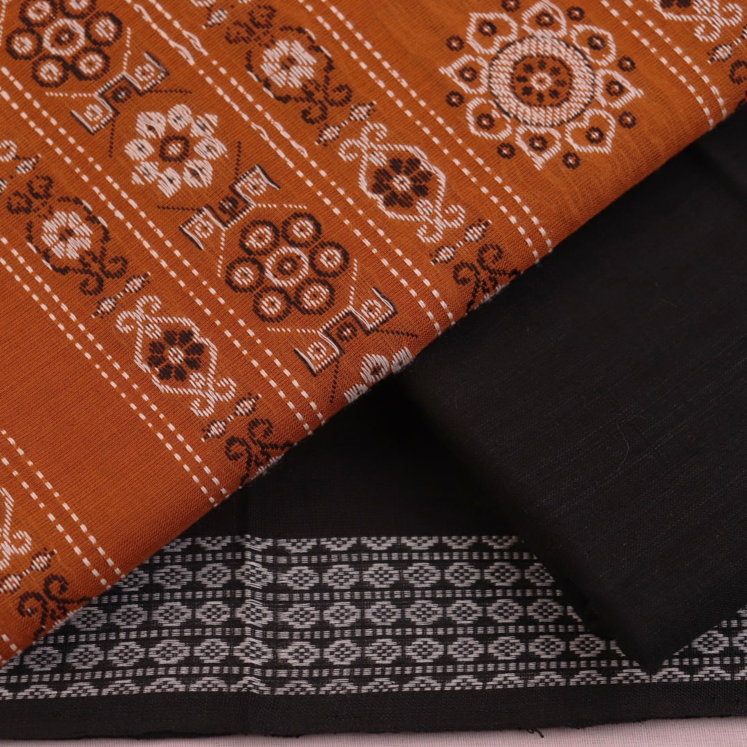 Detailed view of the black Bomkai cotton blouse piece, matching the yellow dress material.