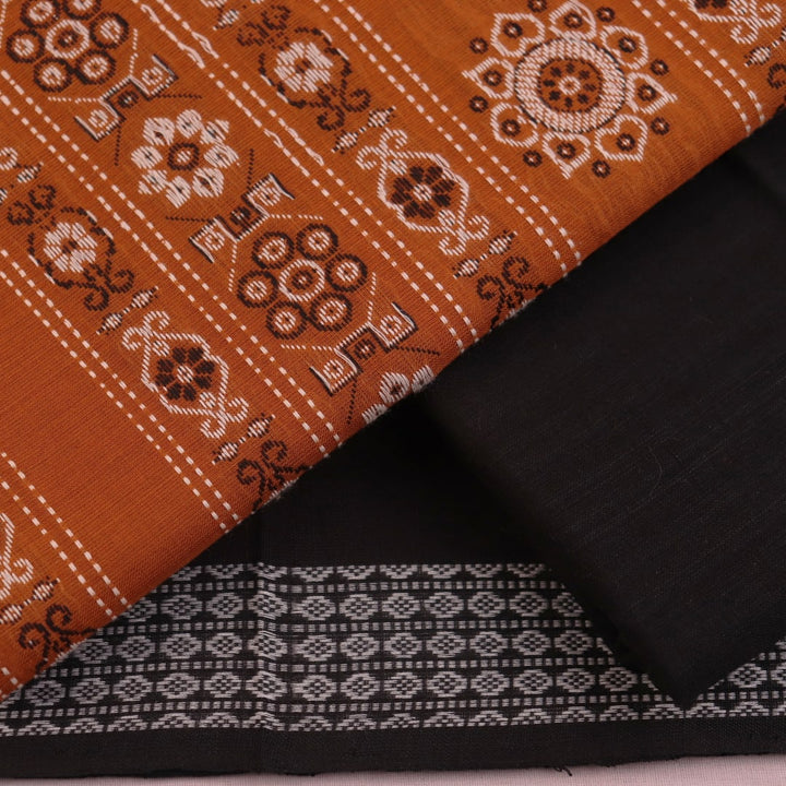 Detailed view of the black Bomkai cotton blouse piece, matching the yellow dress material.