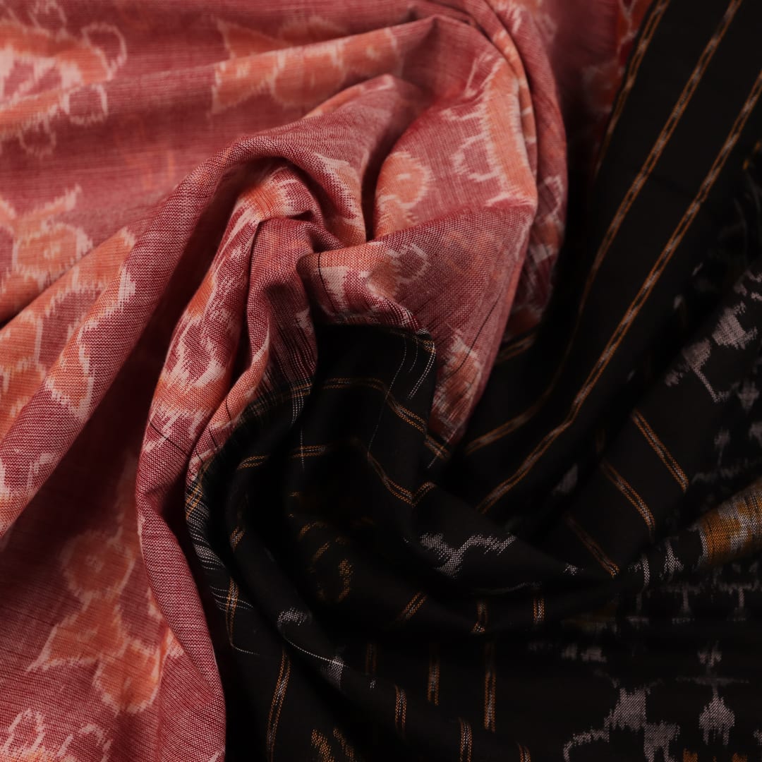 Full view of a peach-colored Sambalpuri cotton saree with black motifs.