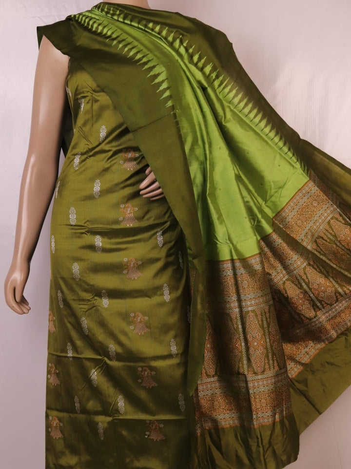 Close-up of the green Bomkai silk dress material's blouse piece with butta pattern.