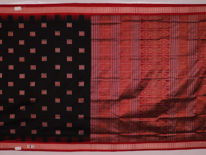 Close-up of black and red silk Sambalpuri saree fabric showcasing intricate motifs