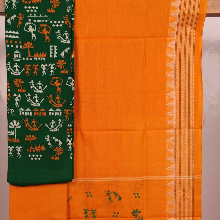 Close-up of green Sambalpuri handloom dress material with a yellow doll pattern