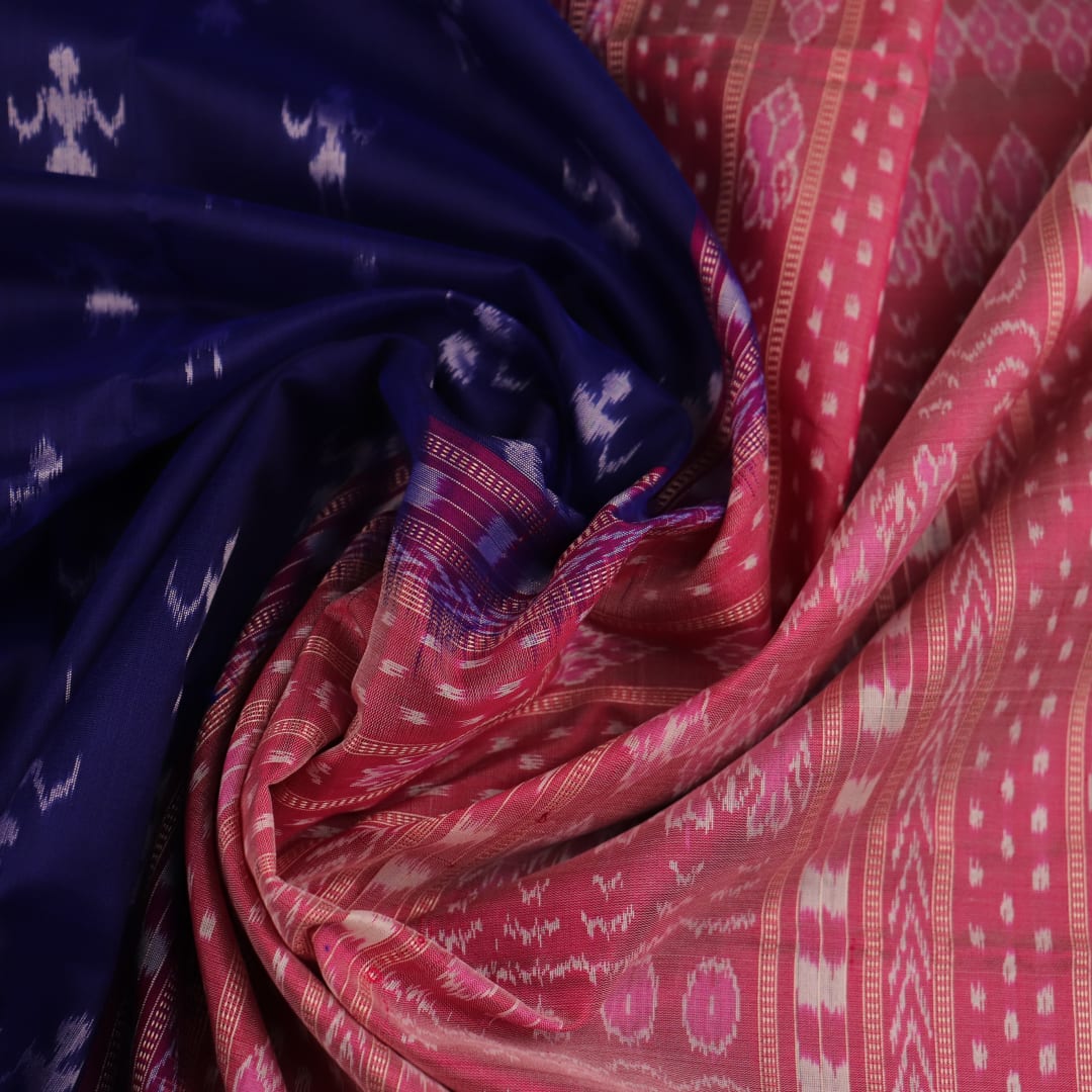 Close-up of soft, shimmering blue and peach silk fabric with intricate Sambalpuri motifs