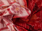 Full view of a white and red Sambalpuri cotton saree with traditional motifs.