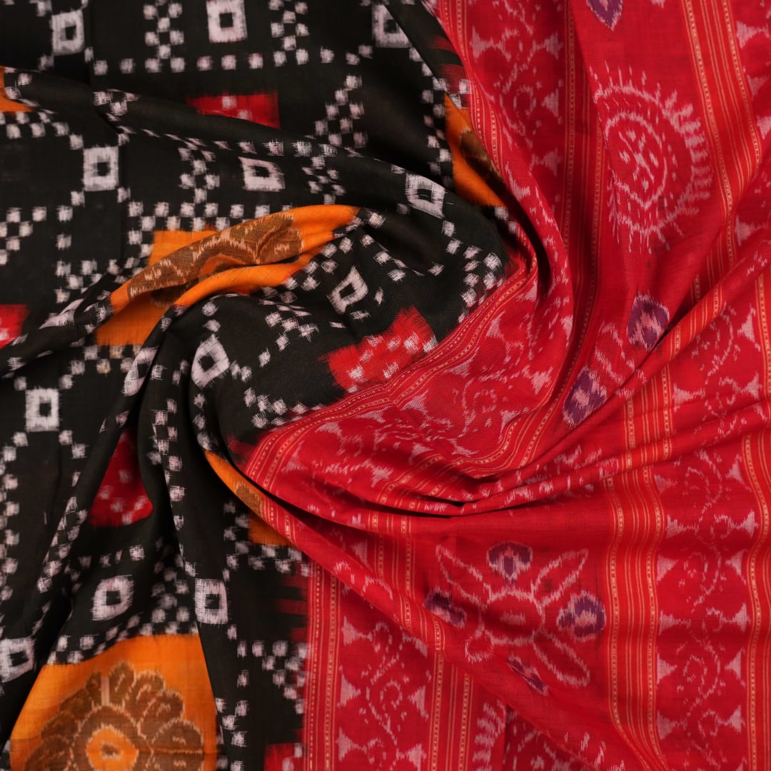 Model draped in a traditional black and red Pasapalli Sambalpuri cotton saree for an elegant ethnic look.