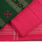 Detail of the blouse piece for a green Sambalpuri cotton dress material with pink motifs.
