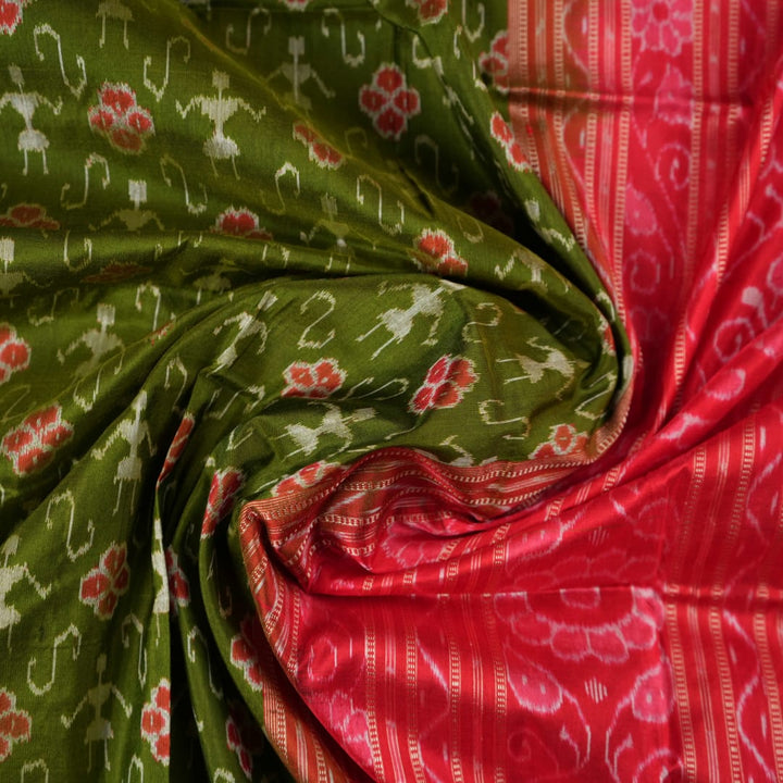 Close-up showing the rich, smooth texture of the green Sambalpuri Silk Saree's weave, highlighting its quality.