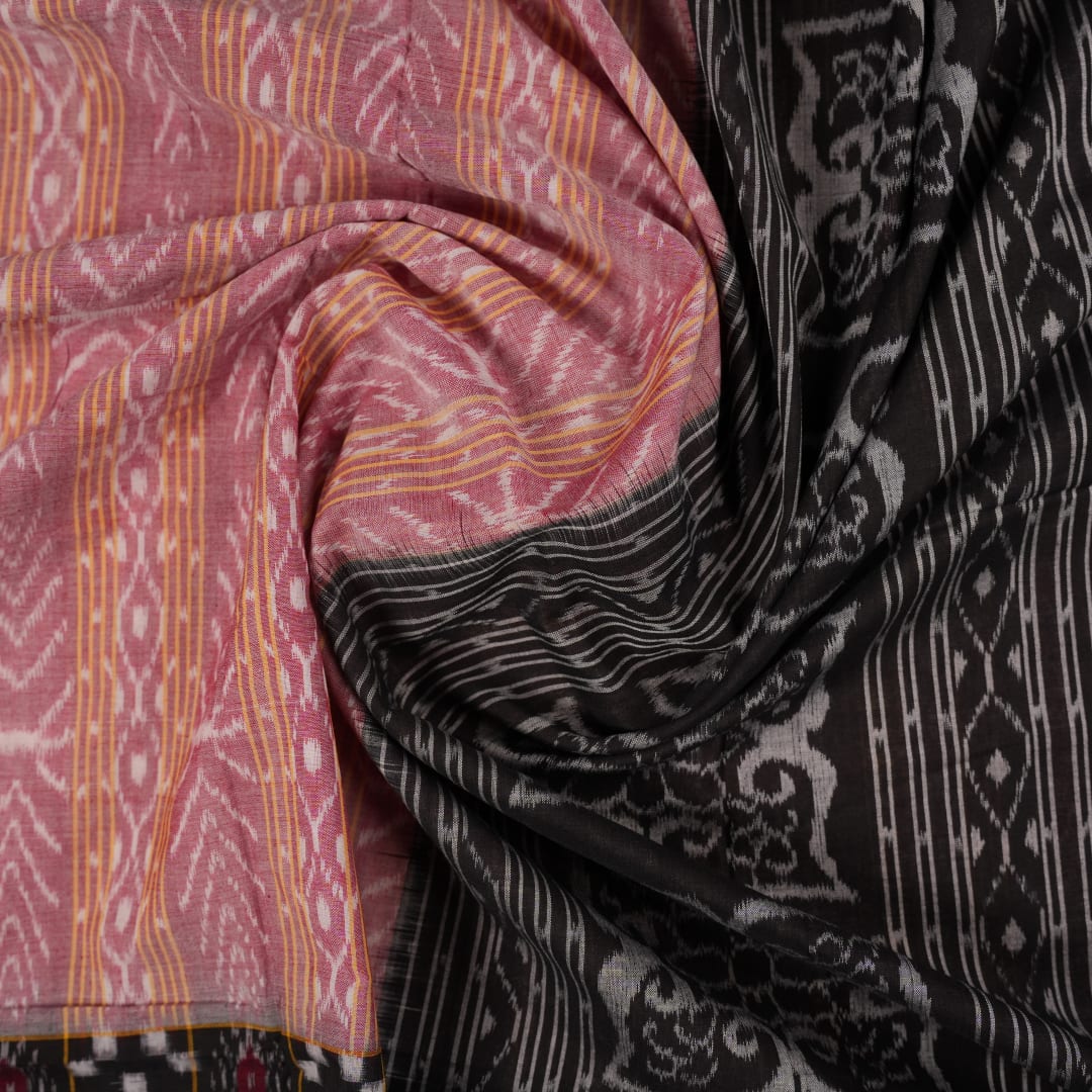 Model wearing a black Sambalpuri cotton saree with multi-color Pasapalli pattern in a full drape.