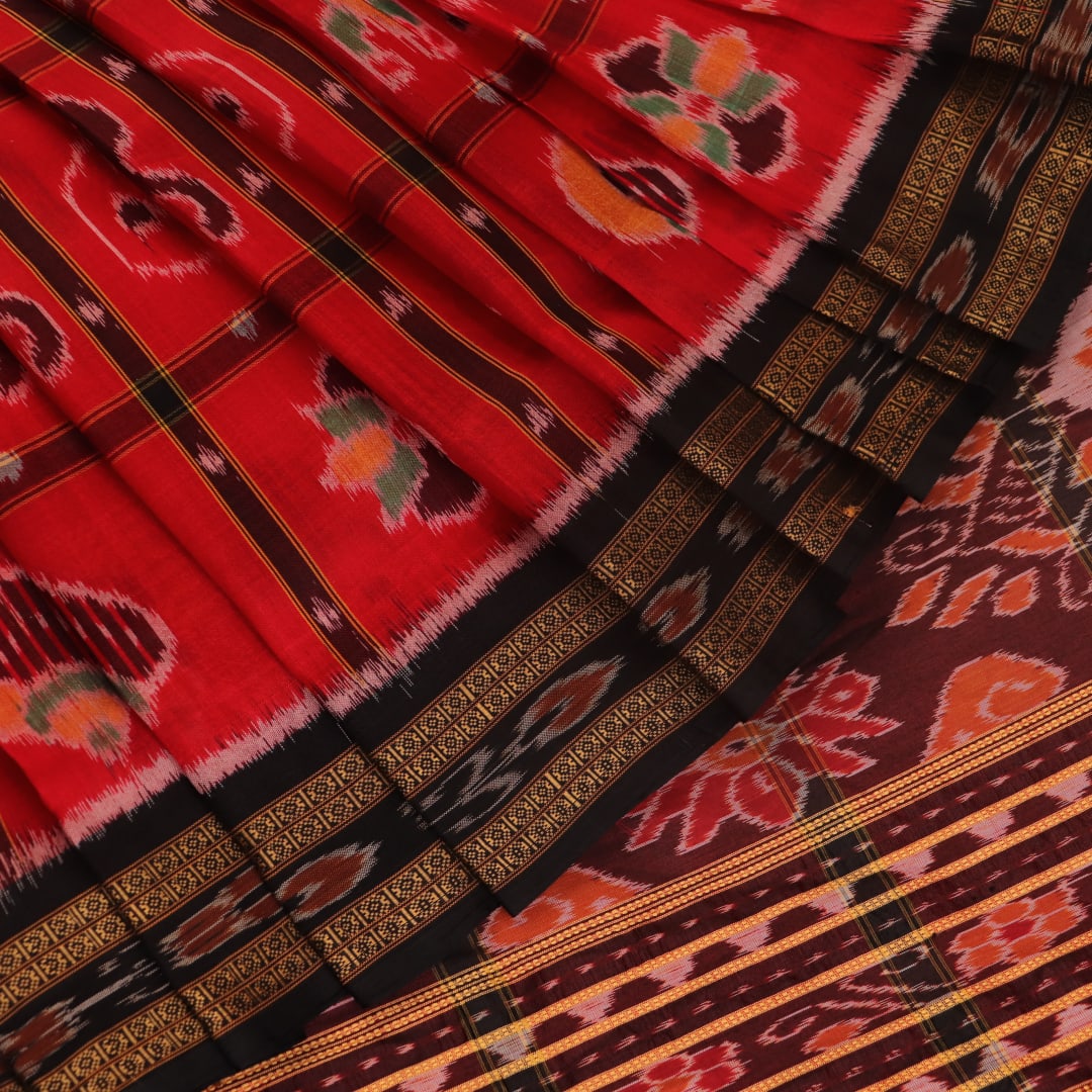 Red and black silk Khandua saree with Nabakothi pattern, styled or draped view showing the overall look.