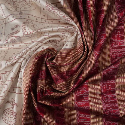 Close-up of the fine silk texture of the white Sambalpuri saree, highlighting its soft sheen and weave.