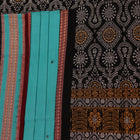 Full view of a blue and black Bomkai cotton saree with intricate butta pattern.