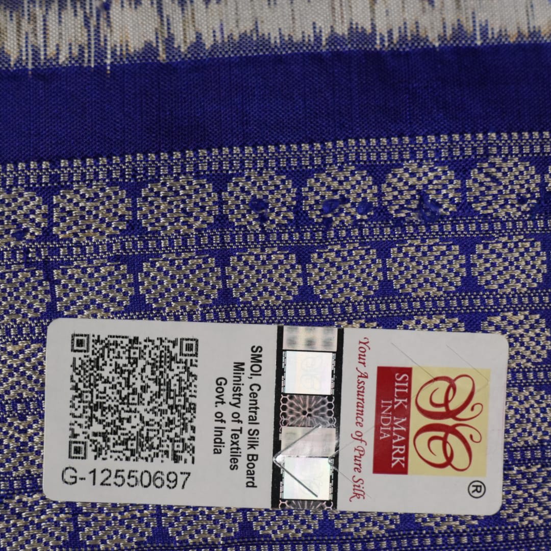 Close-up of the fine texture and handloom weave of the grey and blue Sambalpuri silk fabric