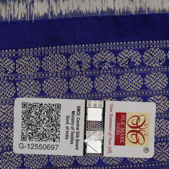 Close-up of the fine texture and handloom weave of the grey and blue Sambalpuri silk fabric