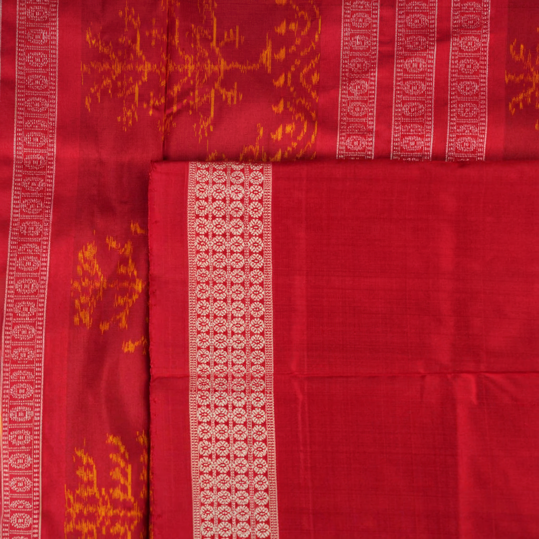 Close-up of the luxurious silk texture of the violet and maroon Sambalpuri Saree fabric.