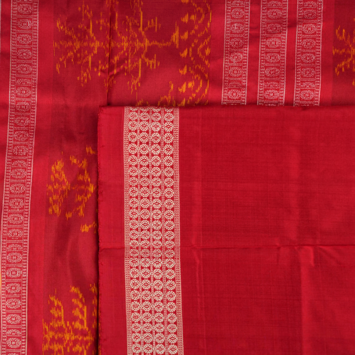 Close-up of the luxurious silk texture of the violet and maroon Sambalpuri Saree fabric.