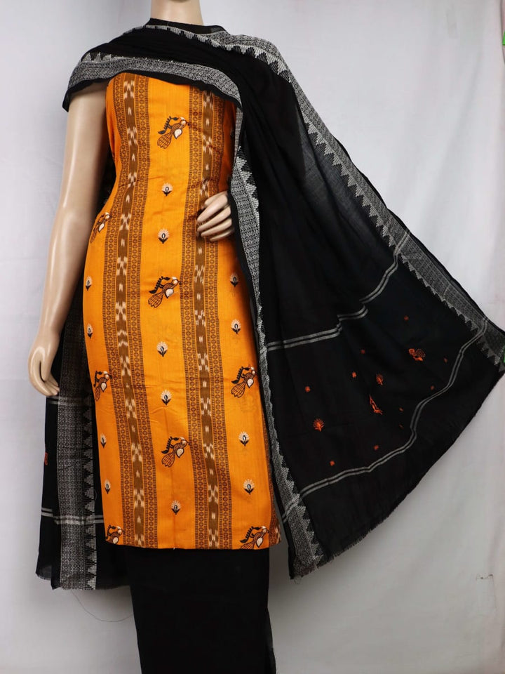 Close-up details of blouse piece with yellow and black motifs and embroidery on cotton Sambalpuri material